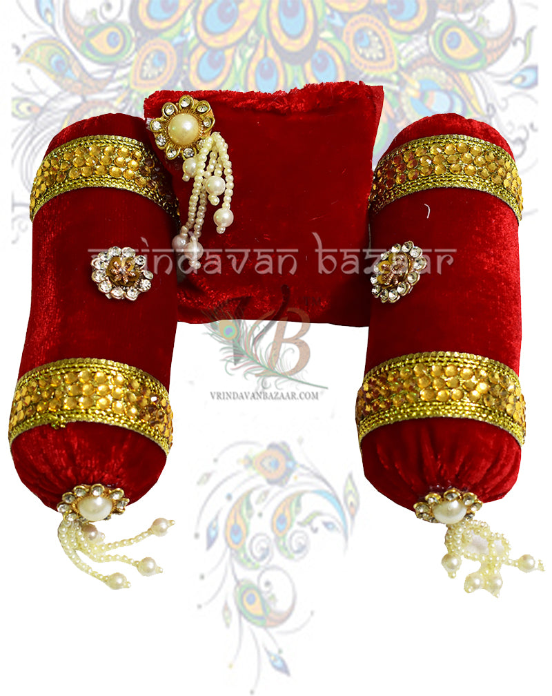 Red velvet decorated cushion with a pair of round pillows