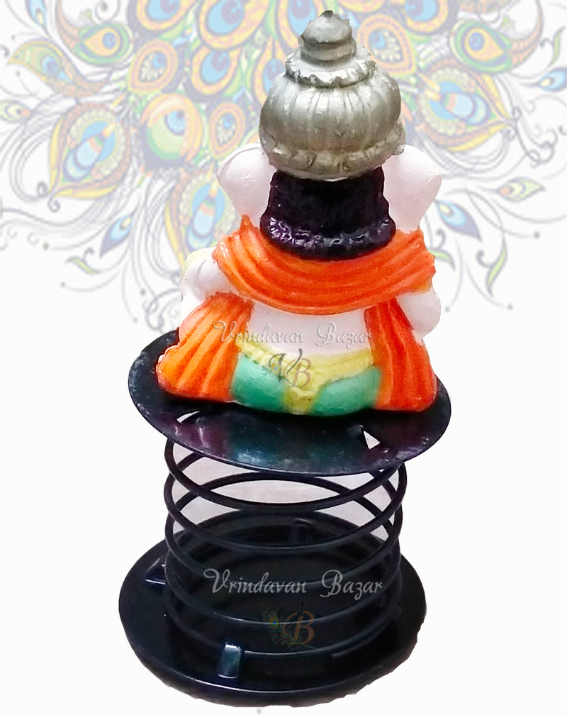 Orange and green Ganpati with dholak (drum) fun spring
