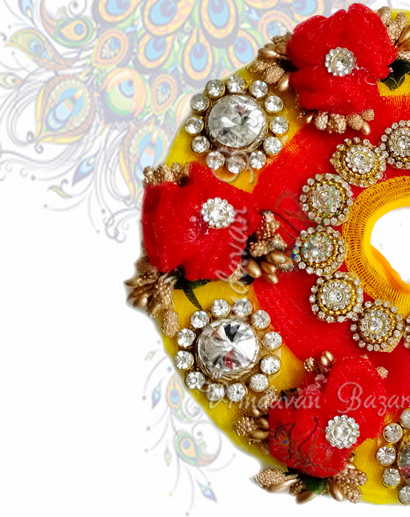 Red ribbon flower on yellow zari laddu gopal dress with kundan stones