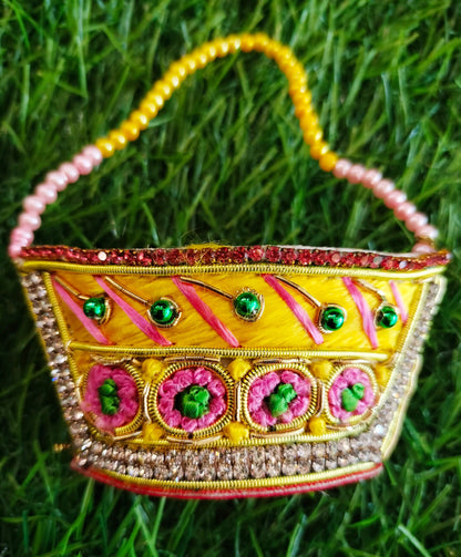 Special zardozi purse in Yellow with pink design