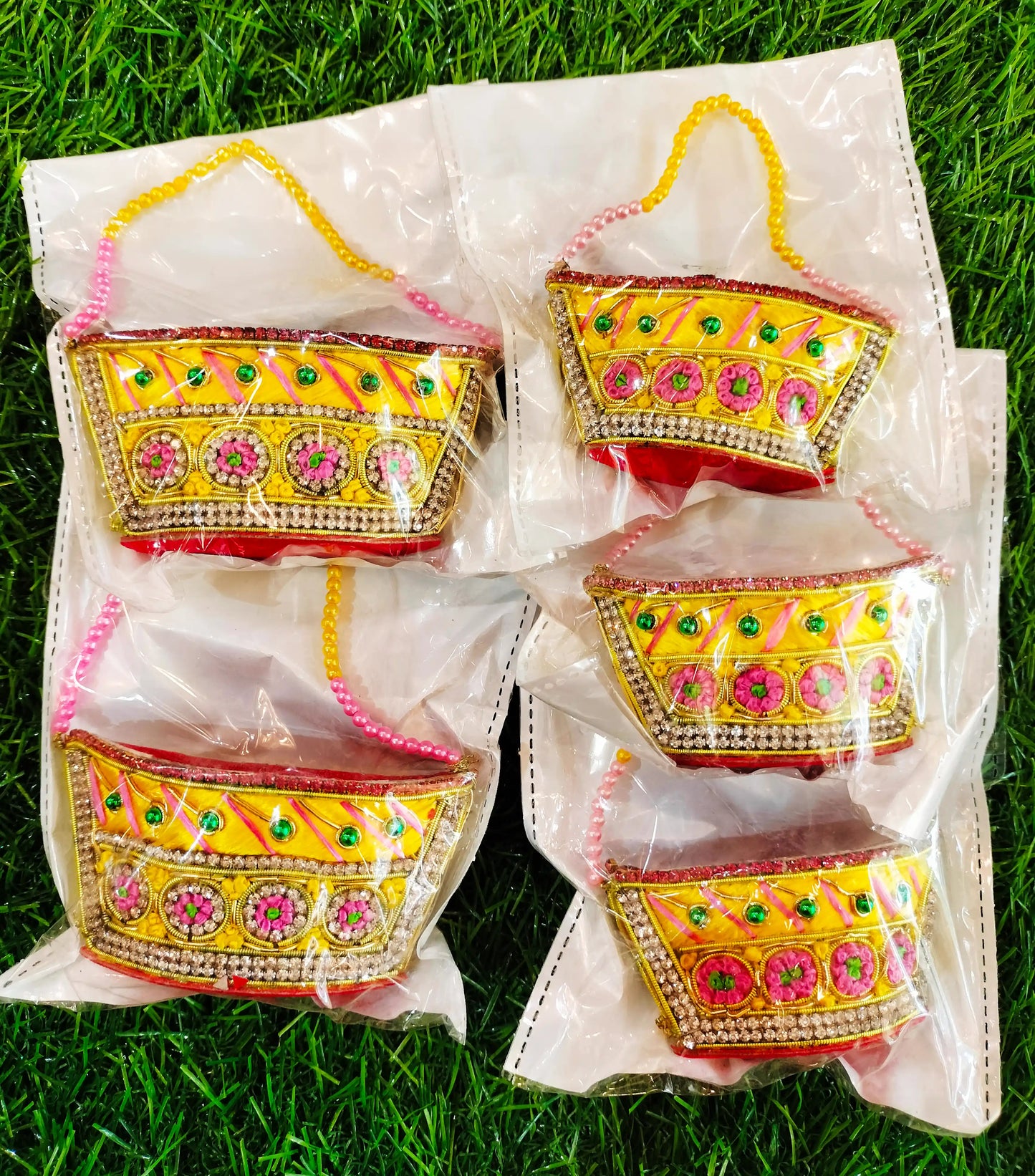 Special zardozi purse in Yellow with pink design