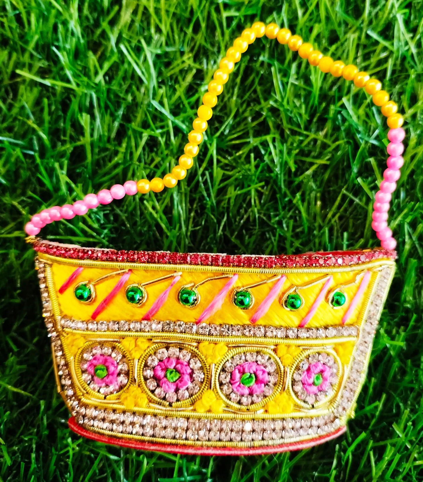 Special zardozi purse in Yellow with pink design