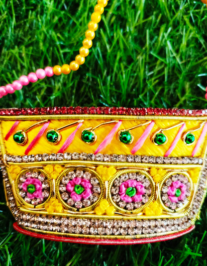 Special zardozi purse in Yellow with pink design