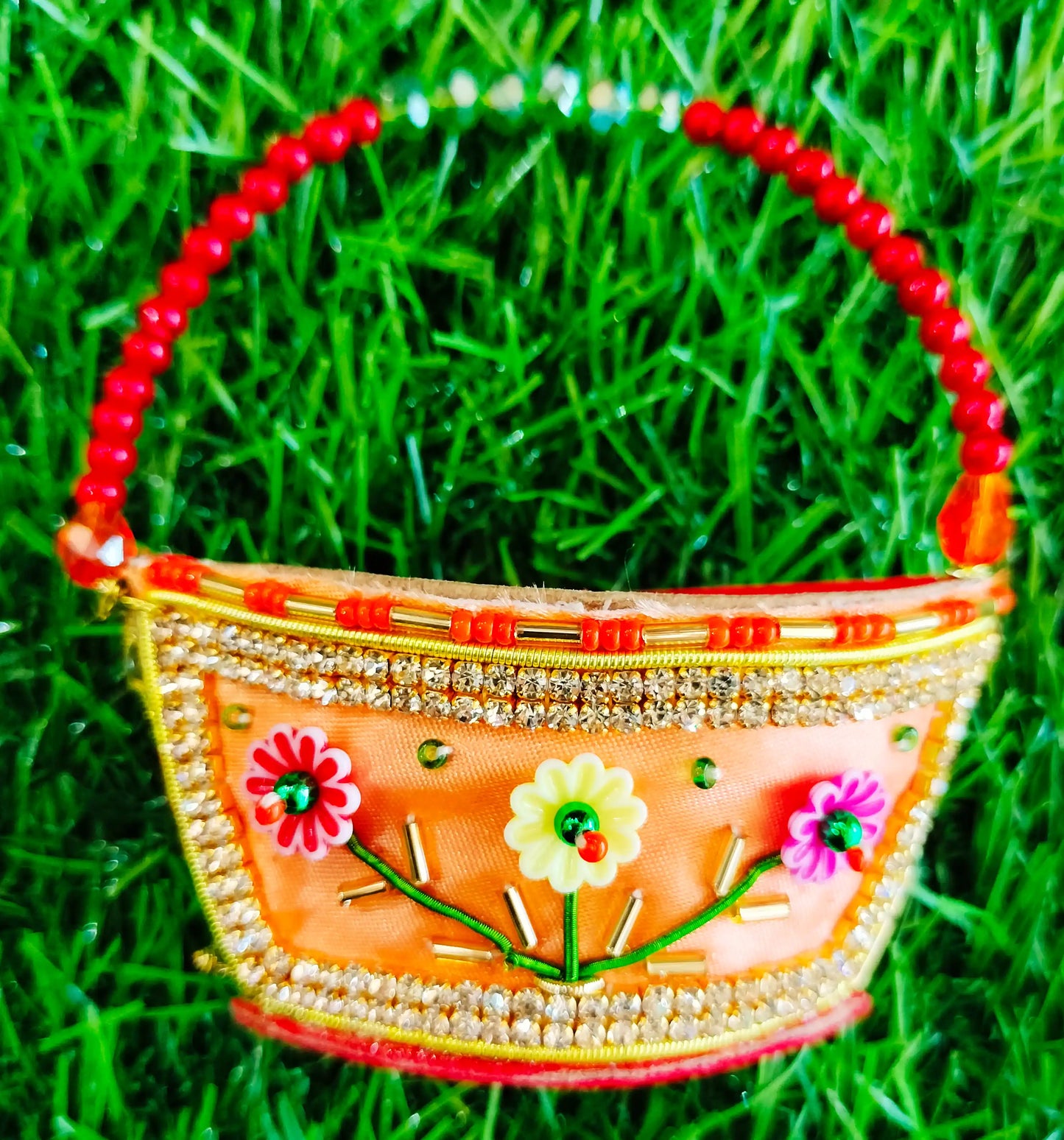 Peach zardozi purse with 3 flower design