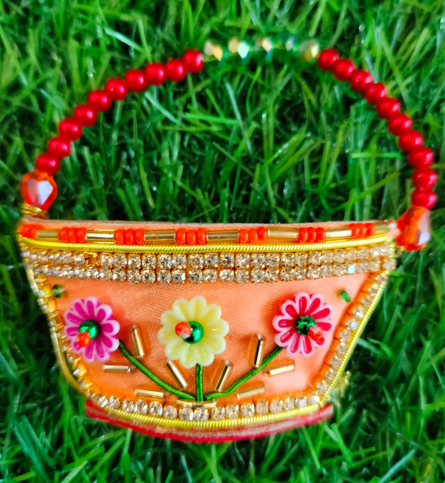 Peach zardozi purse with 3 flower design