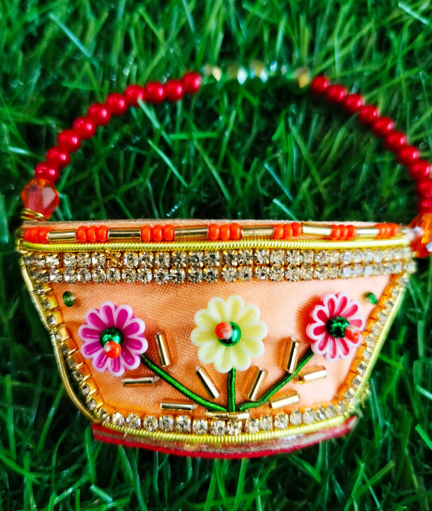 Peach zardozi purse with 3 flower design