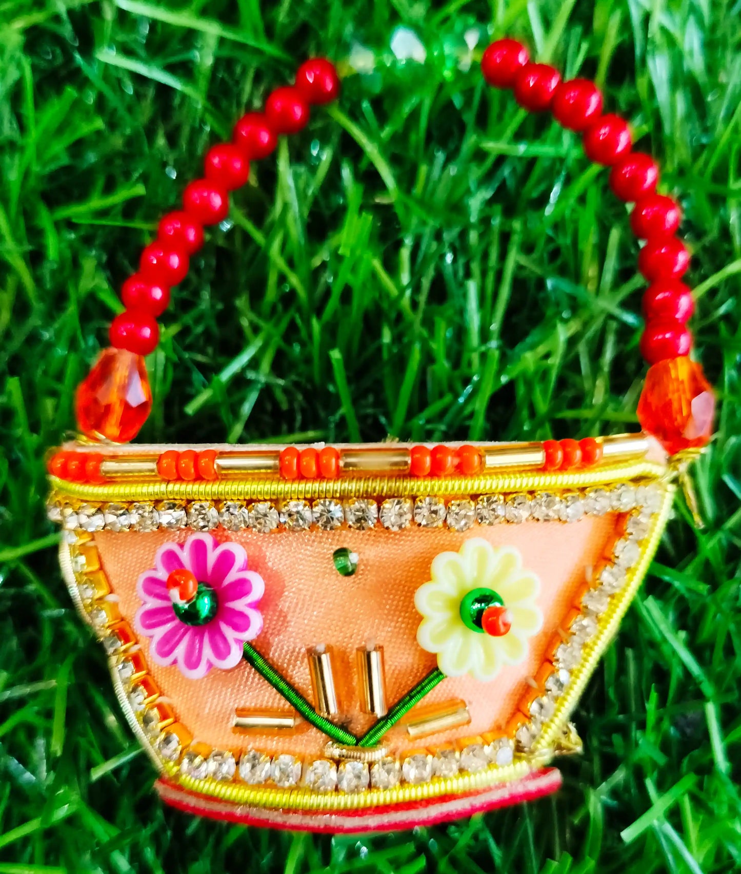 Peach zardozi purse with 3 flower design