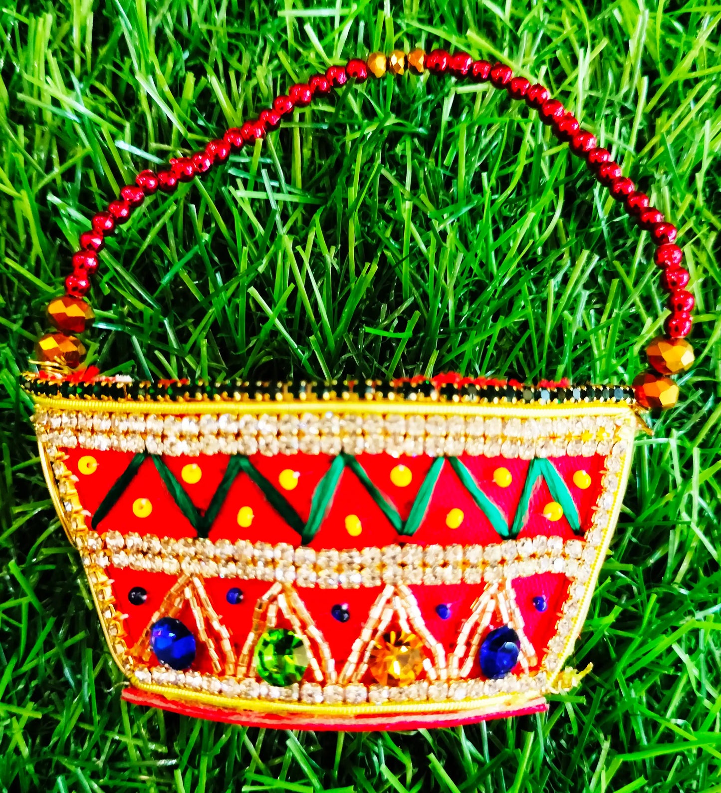 Red zardozi purse with zig zag pattern