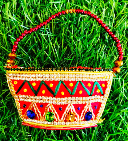 Red zardozi purse with zig zag pattern