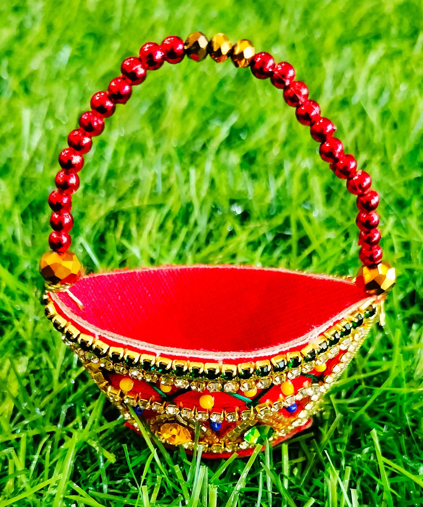 Red zardozi purse with zig zag pattern