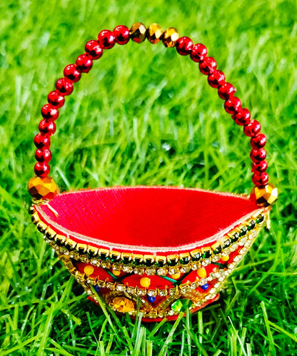 Red zardozi purse with zig zag pattern