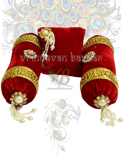 Red velvet decorated cushion with a pair of round pillows