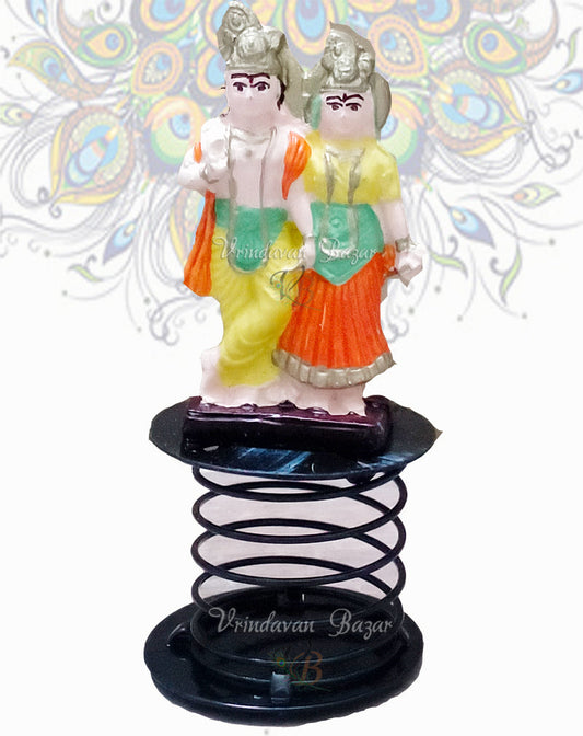 Radha Krishna in orange, green and yellow fun spring