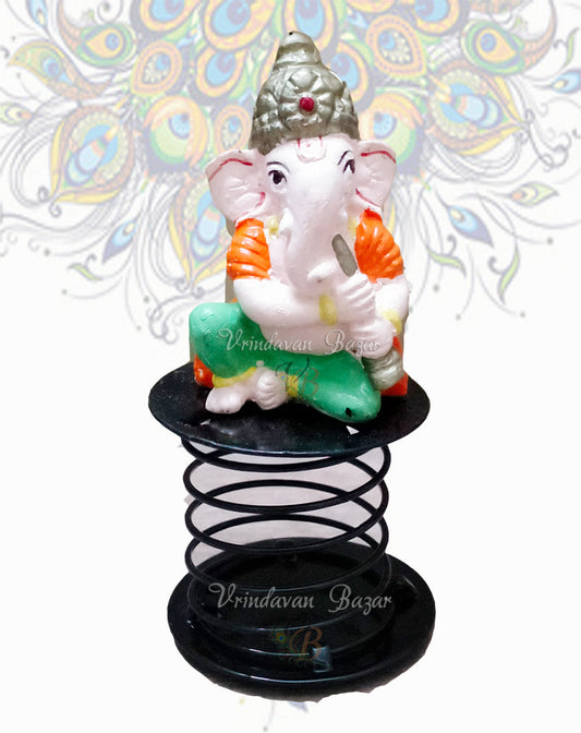 Orange and Green Ganpati with stick fun spring